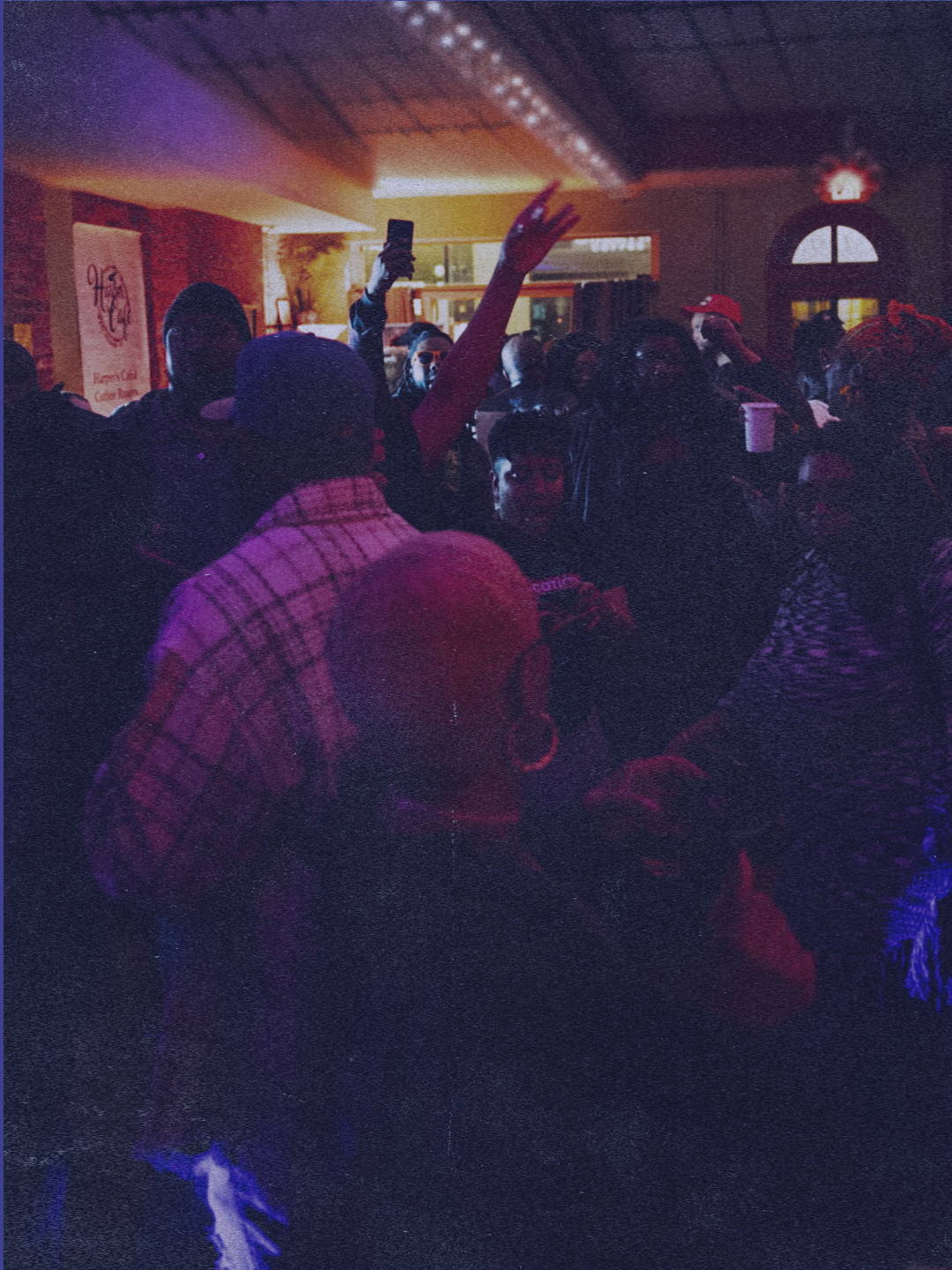 Crowd dancing under stage lights at a New Jersey nightlife event